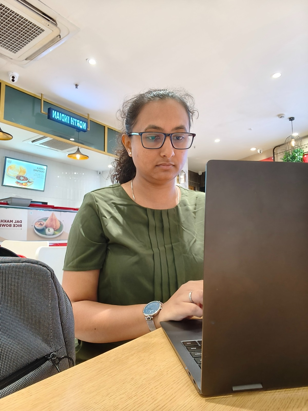 Shruti Bhatt writing at her desk